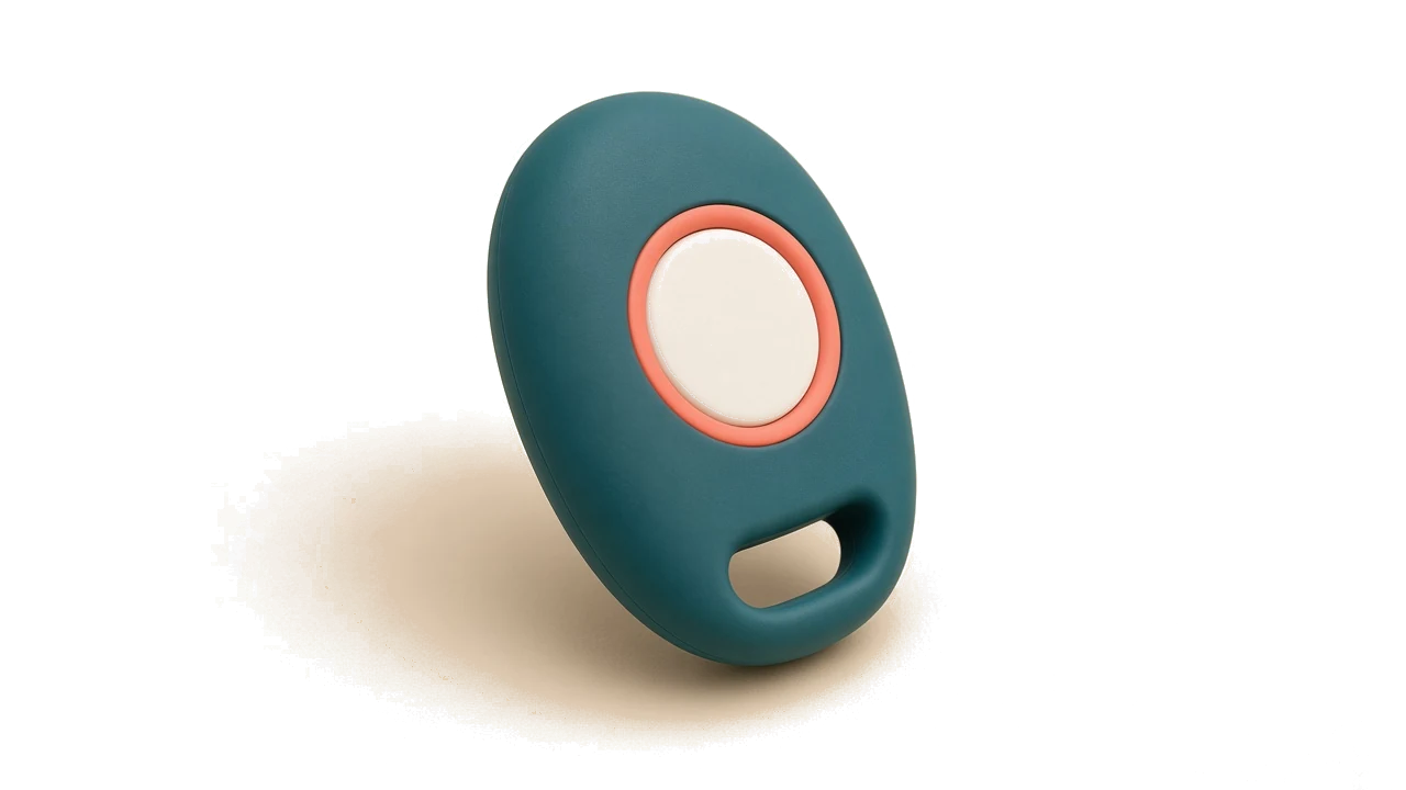 A deep-teal pebble with one cream button and a loop